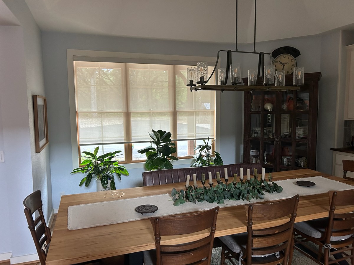 Woven wood shades in a dining room by Love Is Blinds Georgia